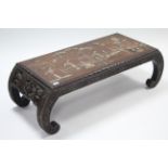 A Chinese carved hardwood low occasional table, inset coloured hardstone group figure scene