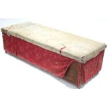 An upholstered deal large storage trunk with hinged lift lid, upholstery w.a.f., 67” long.
