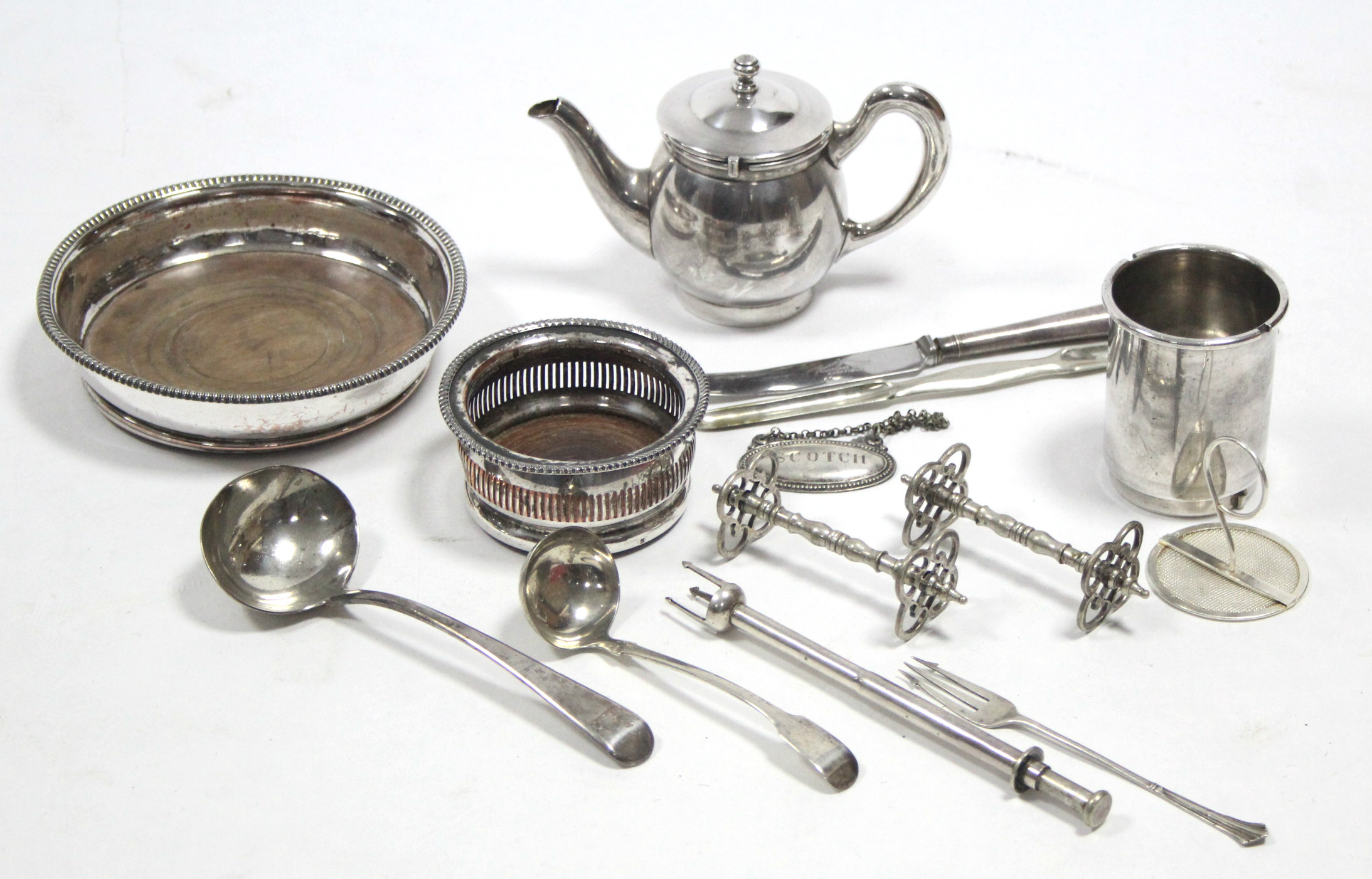 A George III silver ladle, London 1805; another silver ladle; a silver fork; & various items of