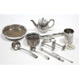A George III silver ladle, London 1805; another silver ladle; a silver fork; & various items of