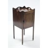 A 19th century mahogany tray-top bedside cabinet enclosed by panel door, & on square legs, 14”