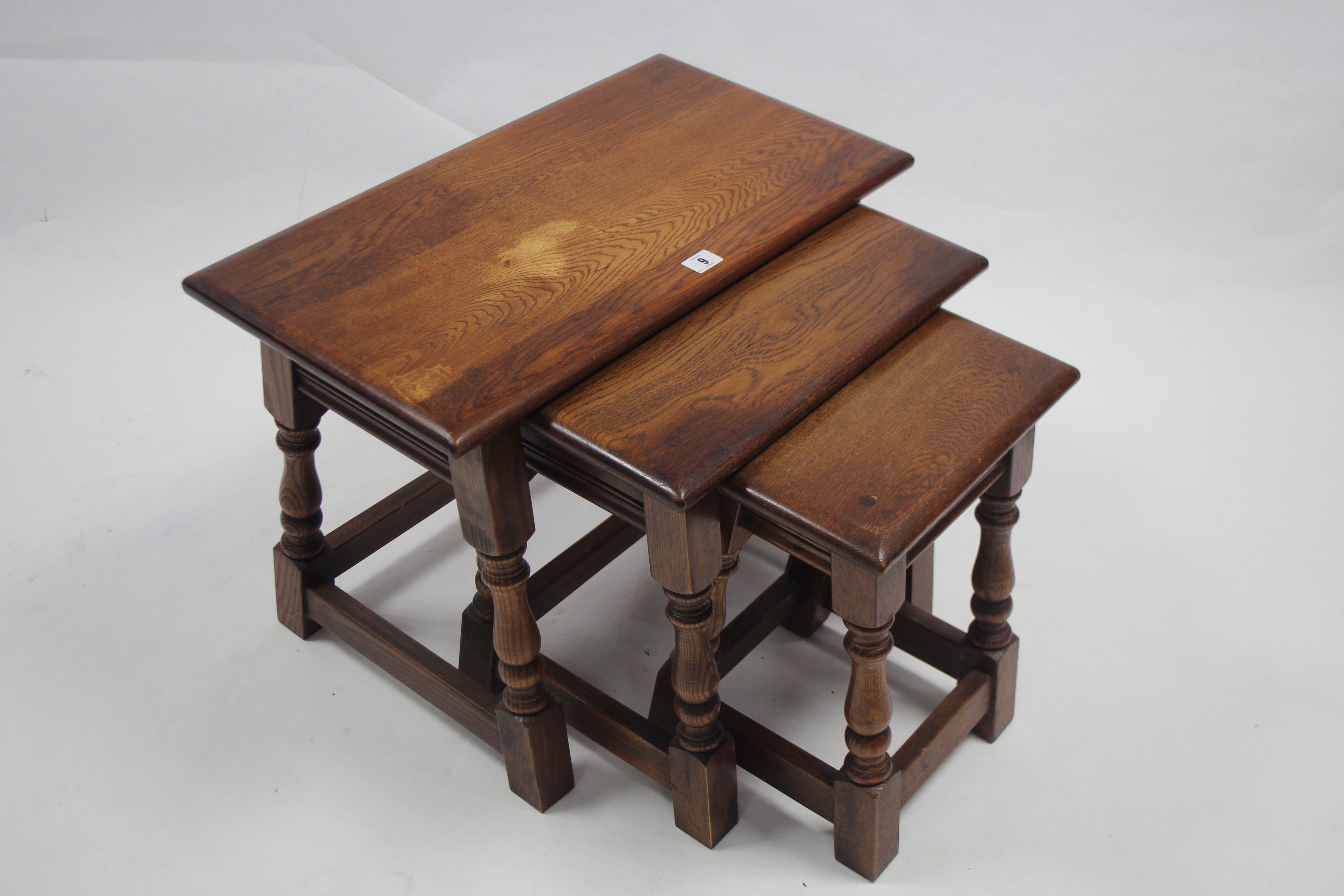 An oak nest of three rectangular occasional tables each table on four baluster-turned legs with - Image 2 of 2