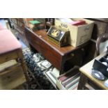 A Victorian mahogany drop-leaf table fitted end drawer & on turned tapered legs with brass