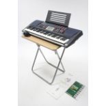 A Casio “CTK 501” portable electronic keyboard, w.o.; & a fold-away occasional table.