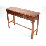 A yew wood side table fitted three frieze drawers & on moulded square legs with plain stretchers,