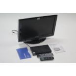 A Toshiba 21” LCD television; & a Grundig SD digital box, each with remote control, w.o.
