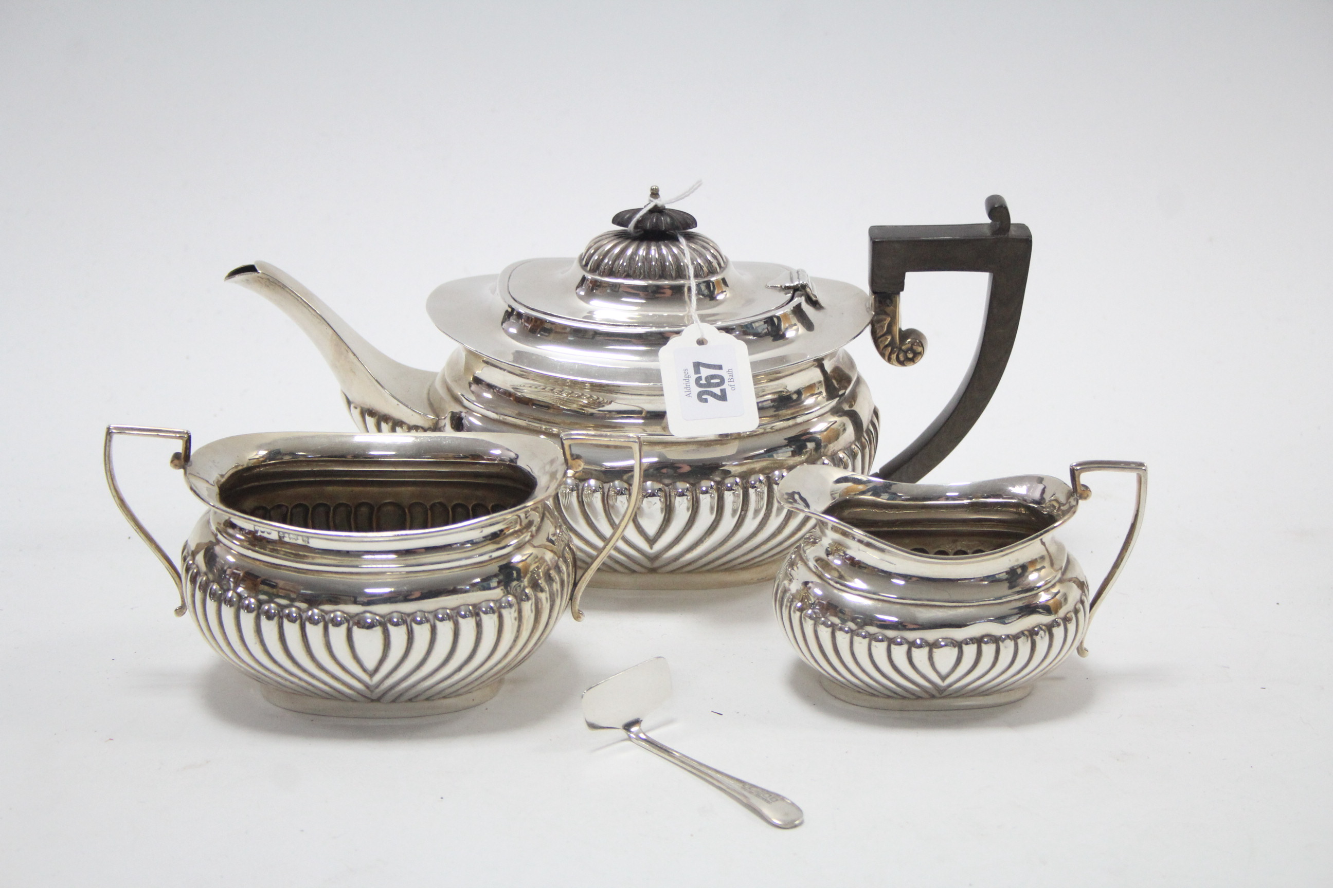 An Edwardian silver three-piece tea service of oblong semi-fluted design, Birmingham 1906.