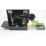 A Singer electric sewing machine (Model No. 222K), w.o. with case.
