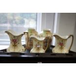 A pair of Fieldings Crown Devon “Wick” pattern ovoid vases, 7¾” high; & a set of three Fieldings