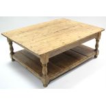 A large pine rectangular two-tier low coffee table on baluster-turned legs, 48” x 34¾”.