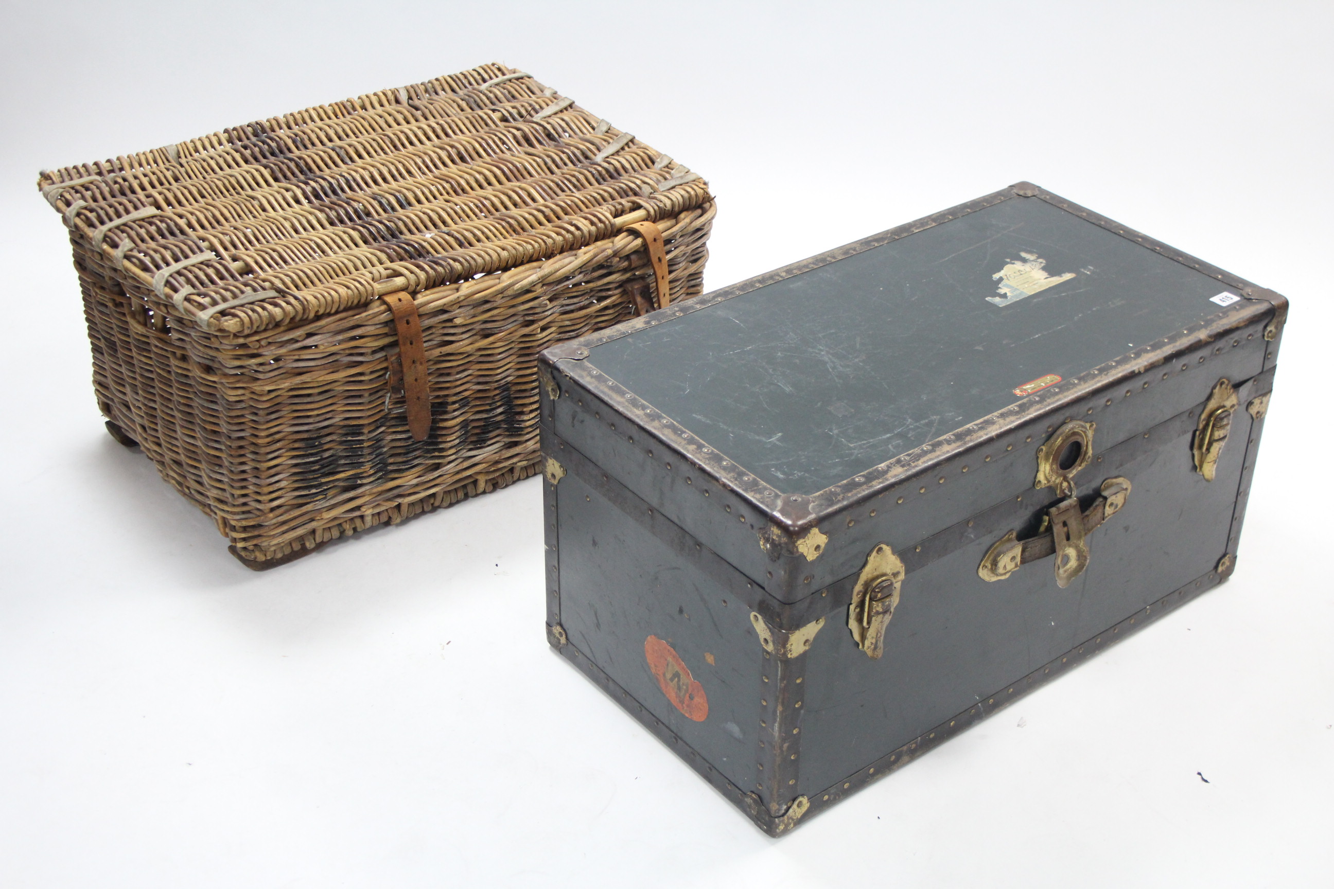 A fibre-covered & brass-studded travelling trunk with hinged lift-lid & leather side handles, 30½”