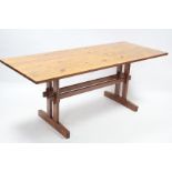 A Pine refectory table with rectangular top, & on square end supports joined by plain centre