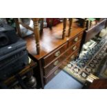 A late Victorian walnut dwarf chest fitted two short & two long graduated drawers with brass swing