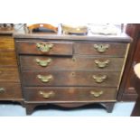 A 19th century oak chest fitted two short & three long graduated drawers with brass swing handles, &