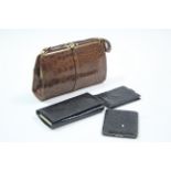 A crocodile skin handbag; a ditto purse; & two ditto wallets.