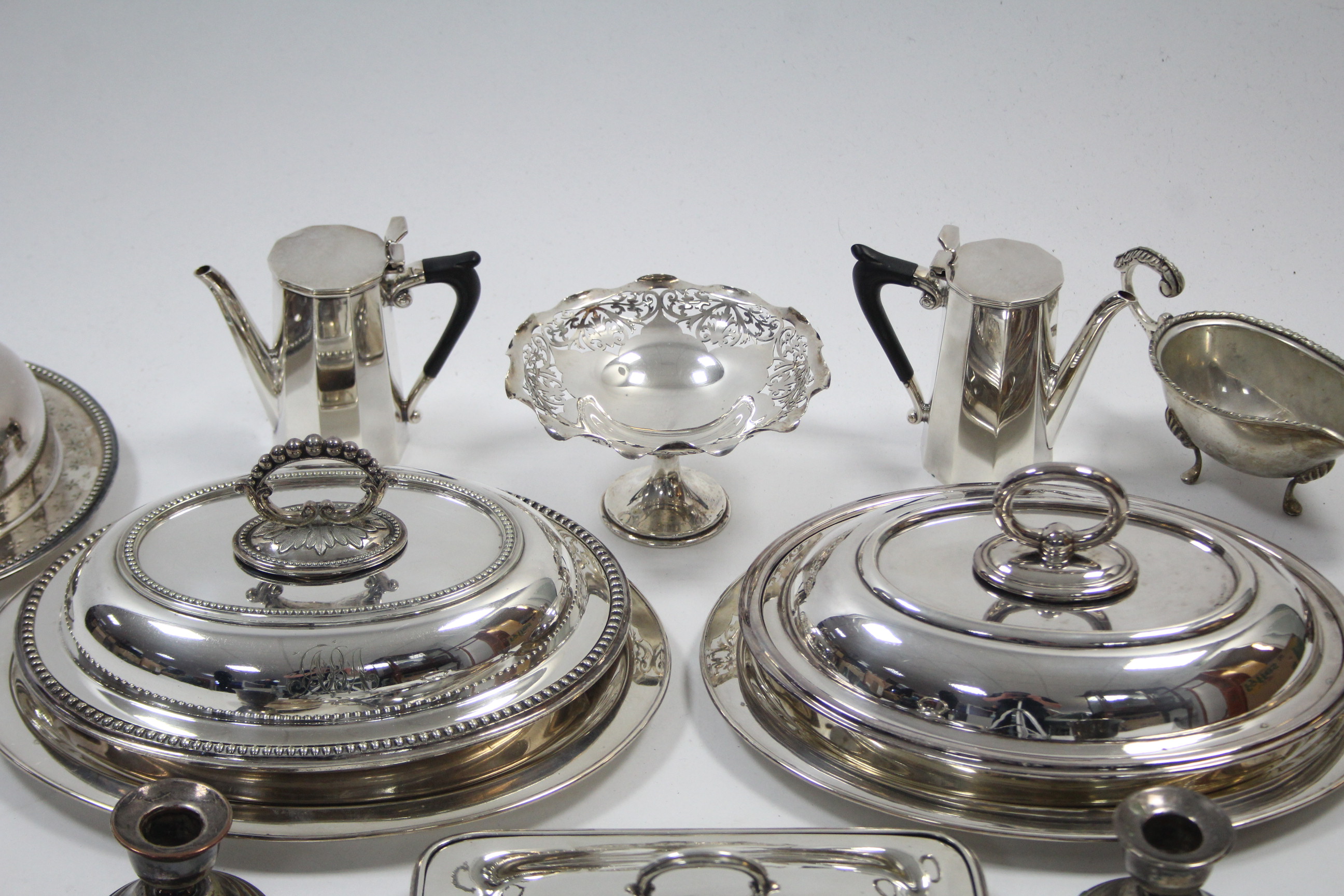 Two silver plated oval entrée dishes; a rectangular ditto; a pair of silver plated dwarf