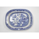 A late Victorian china blue & white “Willow” pattern meat plate, 19” x 14¾”, w.a.f.