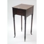 A 19th century mahogany small work table with rectangular top, fitted two long graduated drawers