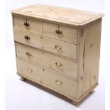 A Victorian pine chest fitted two short & three long graduated drawers with brass swing handles, &