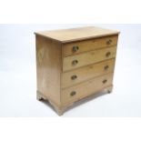 A VICTORIAN PINE CHEST fitted four long graduated drawers with brass swing handles, & on bracket