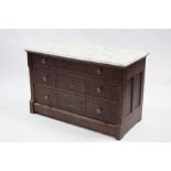 A continental-style carved wooden marble-top low chest fitted three long graduated drawers with
