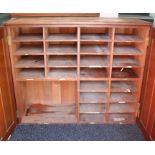 A VICTORIAN PITCH PINE OFFICE CABINET, fitted twenty-five open divisions enclosed by pair of panel