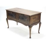 A carved walnut side table fitted two frieze drawers & on slender cabriole legs & pad feet, 48"