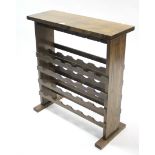An oak twenty-four division standing wine rack with square end supports, 31¾” wide x 35” high.