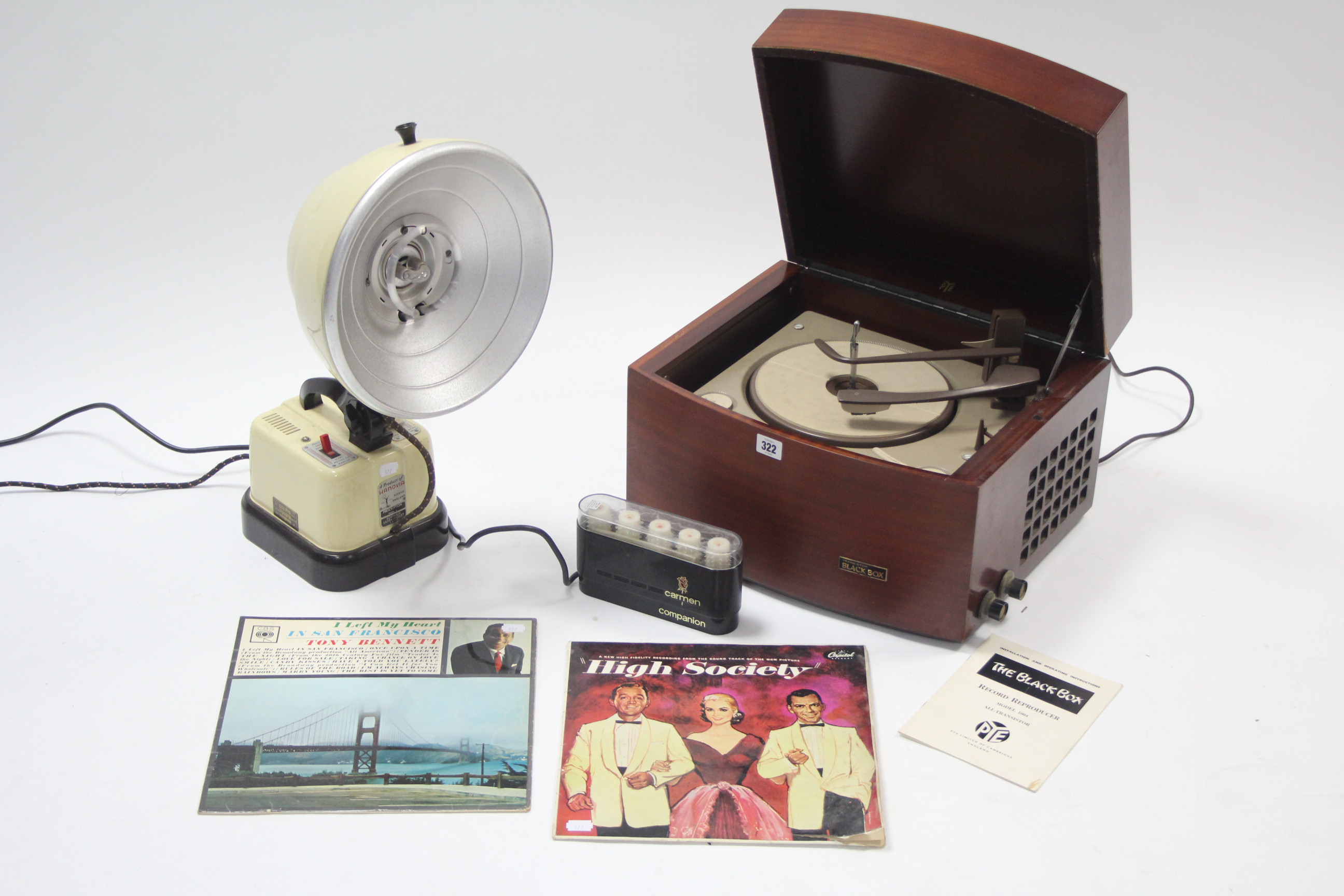 A Pye “Black Box” record player in mahogany case; together with two L. P. records; a Hanovia