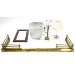 A brass adjustable fire curb; two table lamps; a white glazed jardinière; & a small rectangular wall