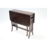 An Edwardian inlaid-mahogany Sutherland table with canted corners to the rectangular top, & on