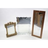 A Venetian-style rectangular wall mirror, 29½” x 21¾”; a gilt frame rectangular wall mirror; &