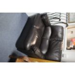 A dark brown leather two-seater settee, 48” long.