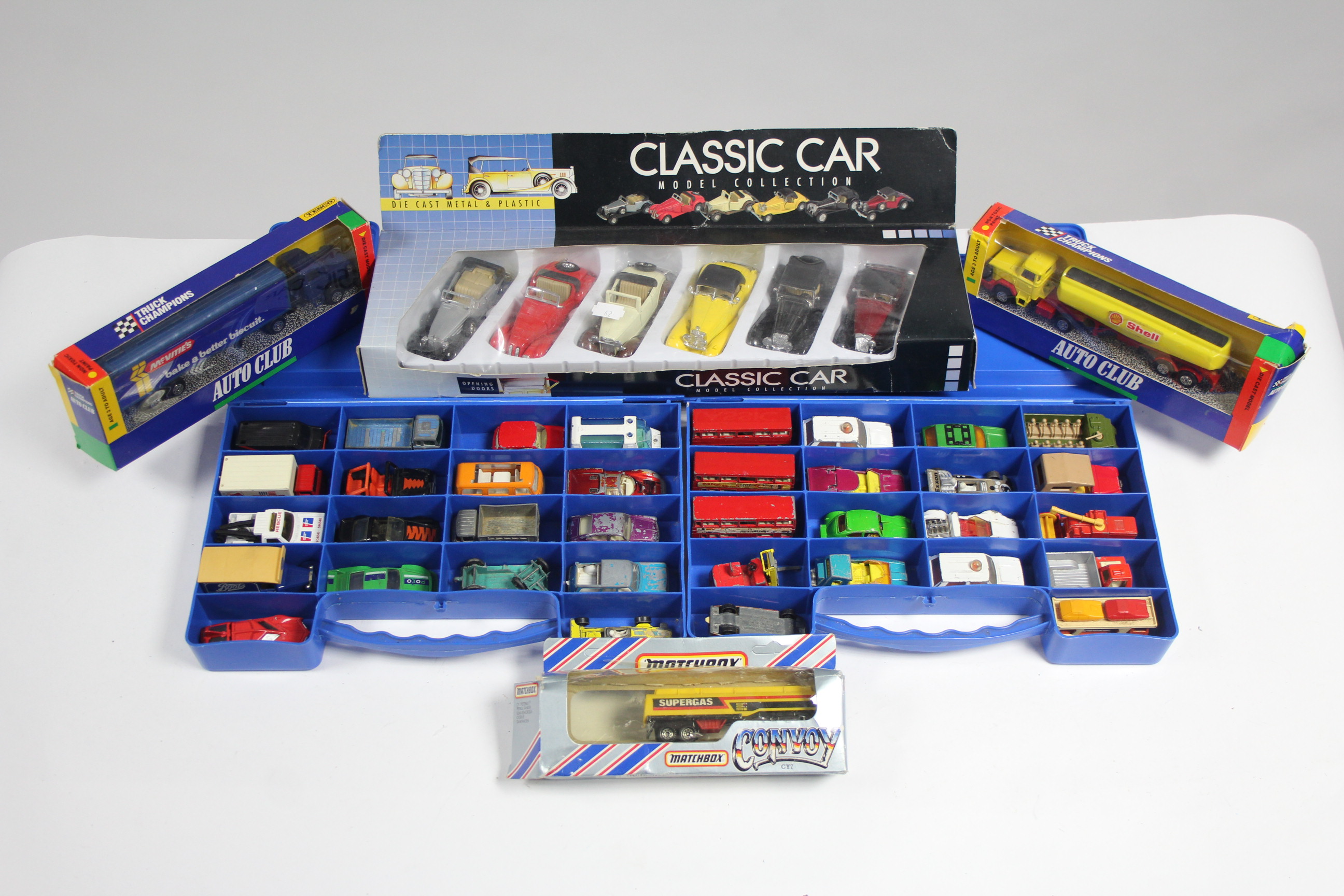 Approximately fifty various scale models by Britains, Corgi, Matchbox, etc., boxed & un-boxed.