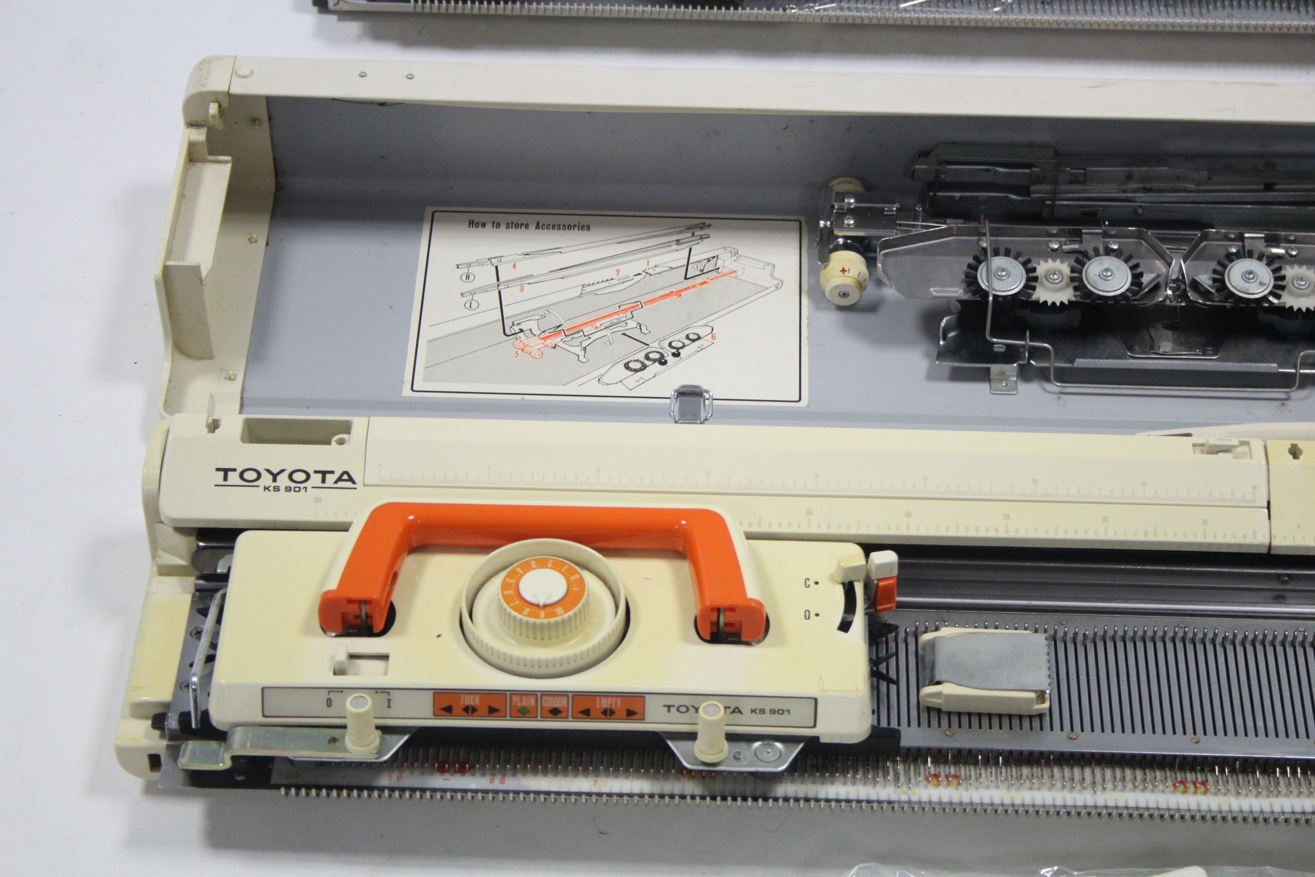 A Toyota knitting machine; and a Knitmaster ditto, each with case and various accessories.