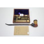 A BUSS of London brass hydrometer in mahogany case; one volume “Spirit Tables for Sike’s