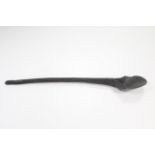 An African carved wood long-handled ladle with shaped bowl; 30" long.