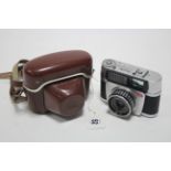 A Braun Paxette Electromatic 1 40mm camera with leather case.