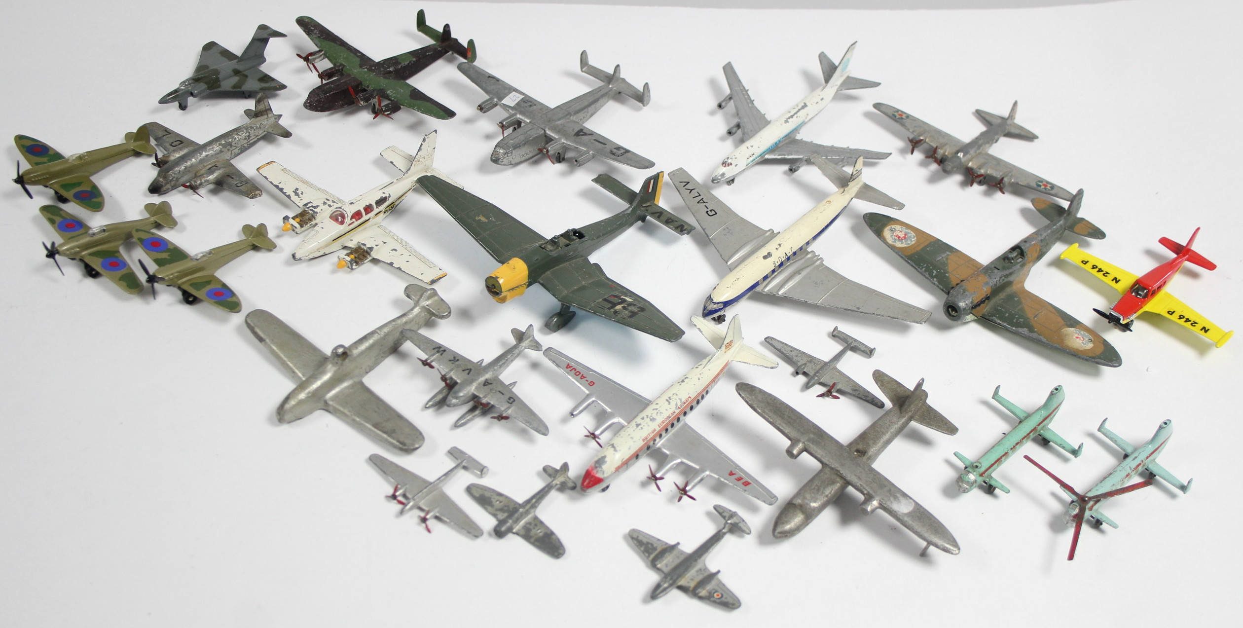 Twenty four various die-cast scale model aeroplanes by Dinky, Lesney, & others, all un-boxed.