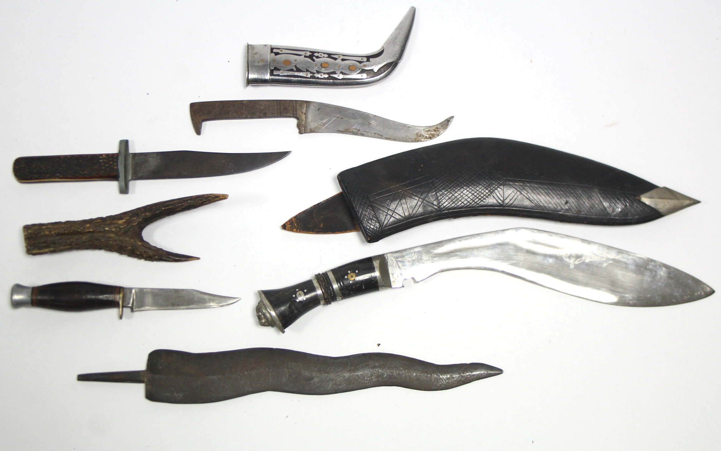An Indian Kukri with leather sheath; & six various knives