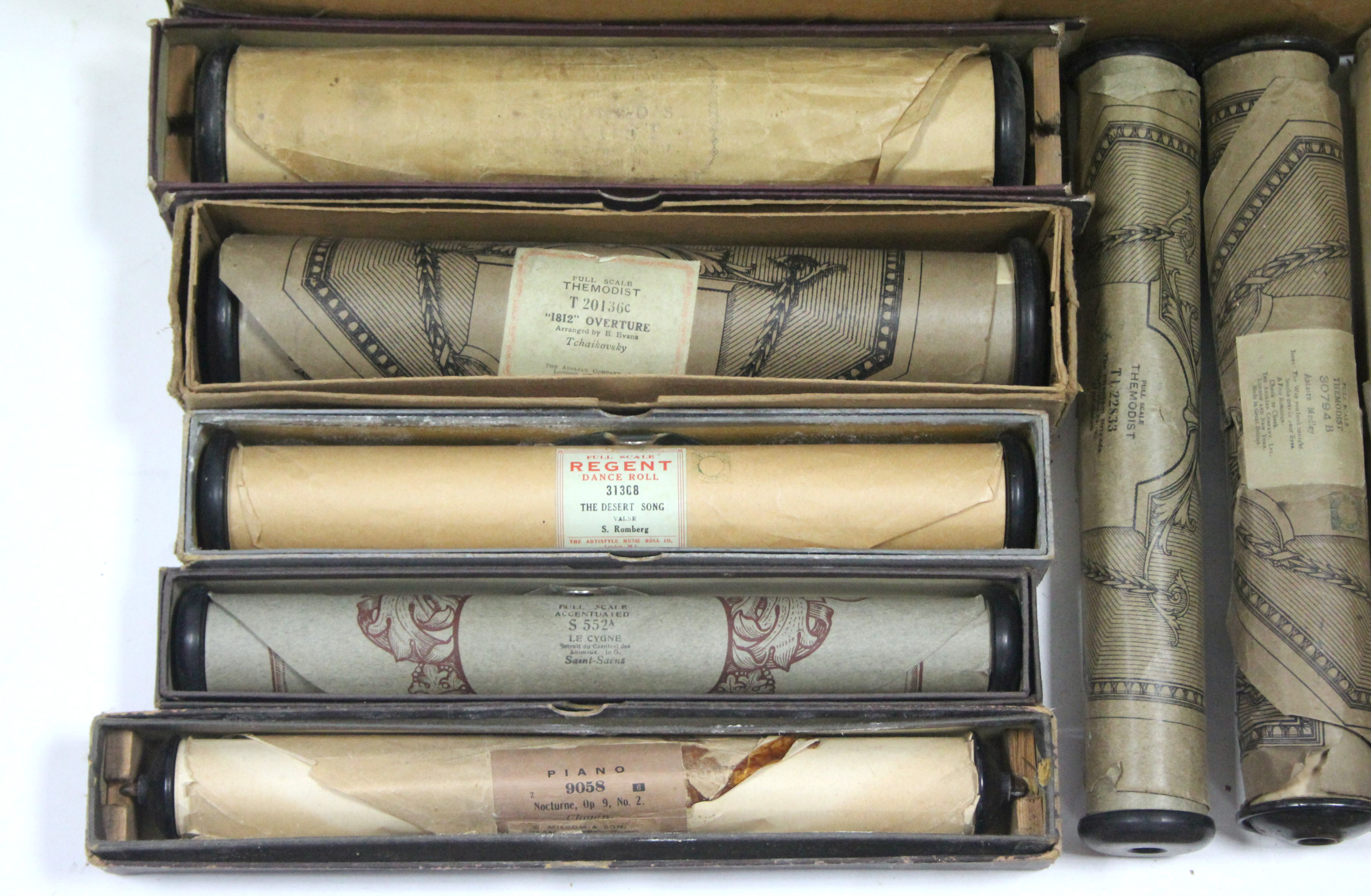 Approximately sixty various pianola rolls, boxed & un-boxed.