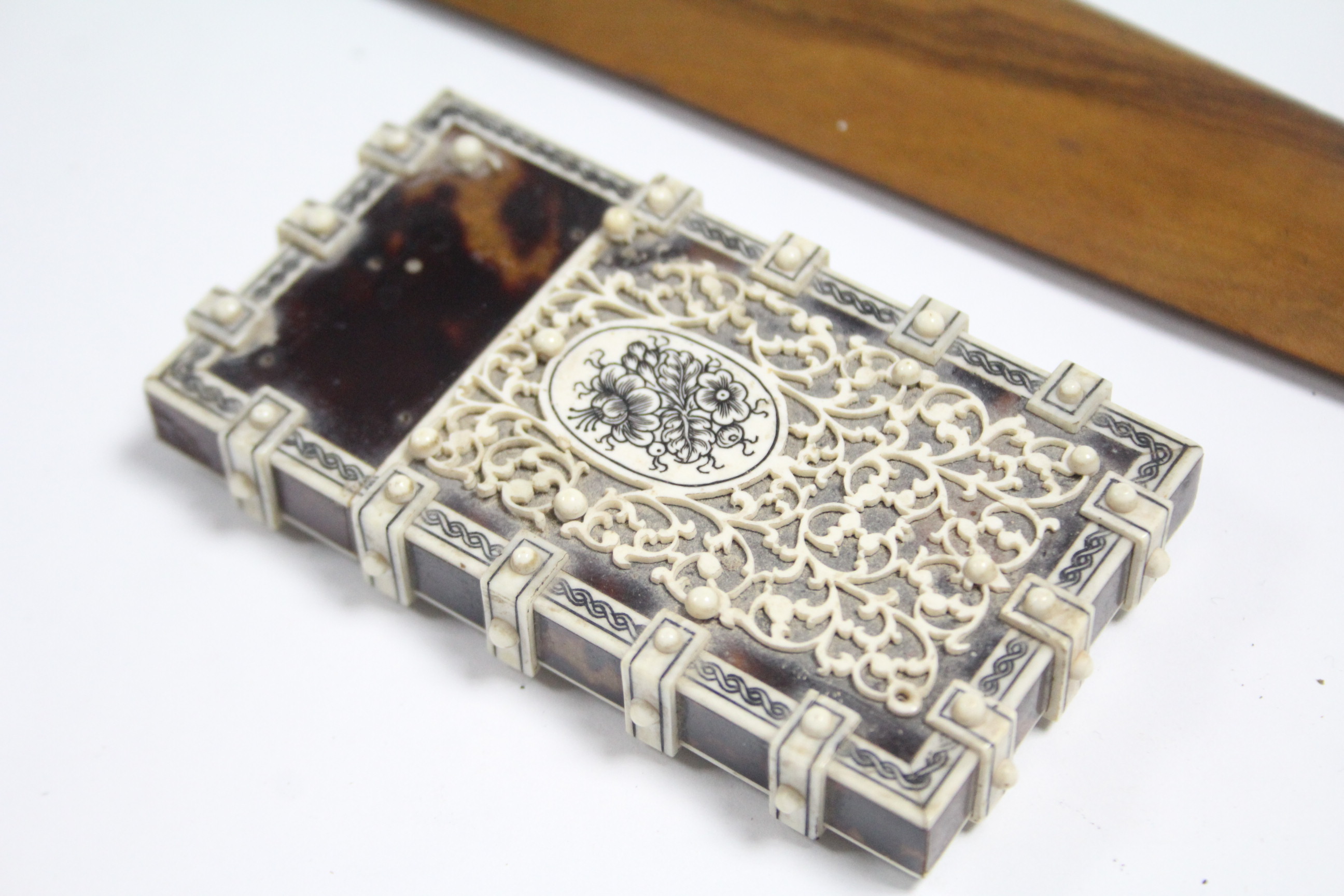 A late 19th century ivory & tortoiseshell card case, 3¾” x 2” (slight faults); & an inlaid-treen