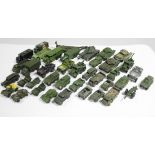 Forty nine various Dinky scale model military vehicles, all un-boxed.