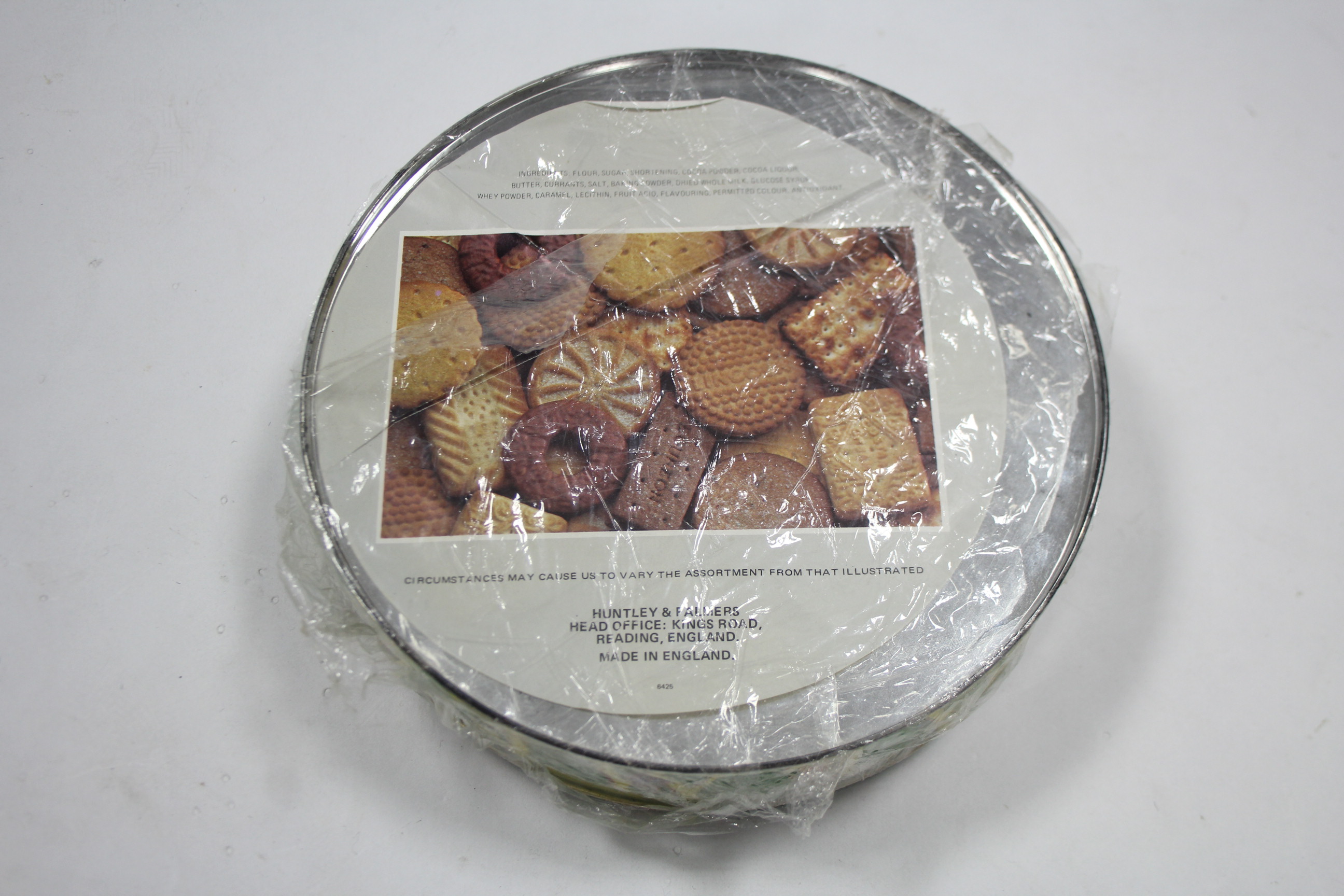 A HUNTLEY & PALMERS “NAUGHTY” BISCUIT TIN, COMPLETE WITH ORIGINAL CONTENTS, the circular tin - Image 4 of 4