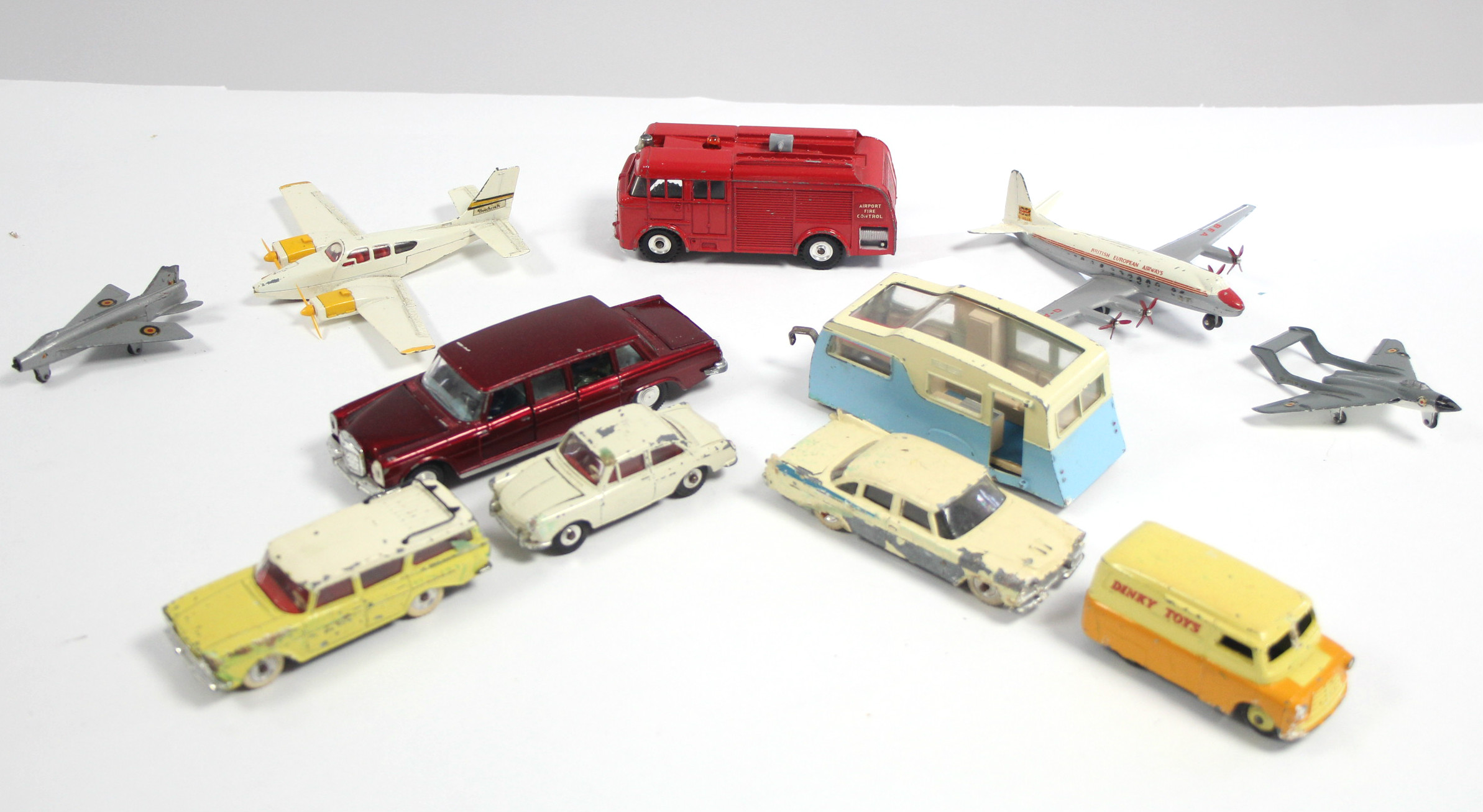 A Dinky scale model “Mercedes-Benz 600” car (No. 128); a ditto scale model “Four Berth Caravan”;