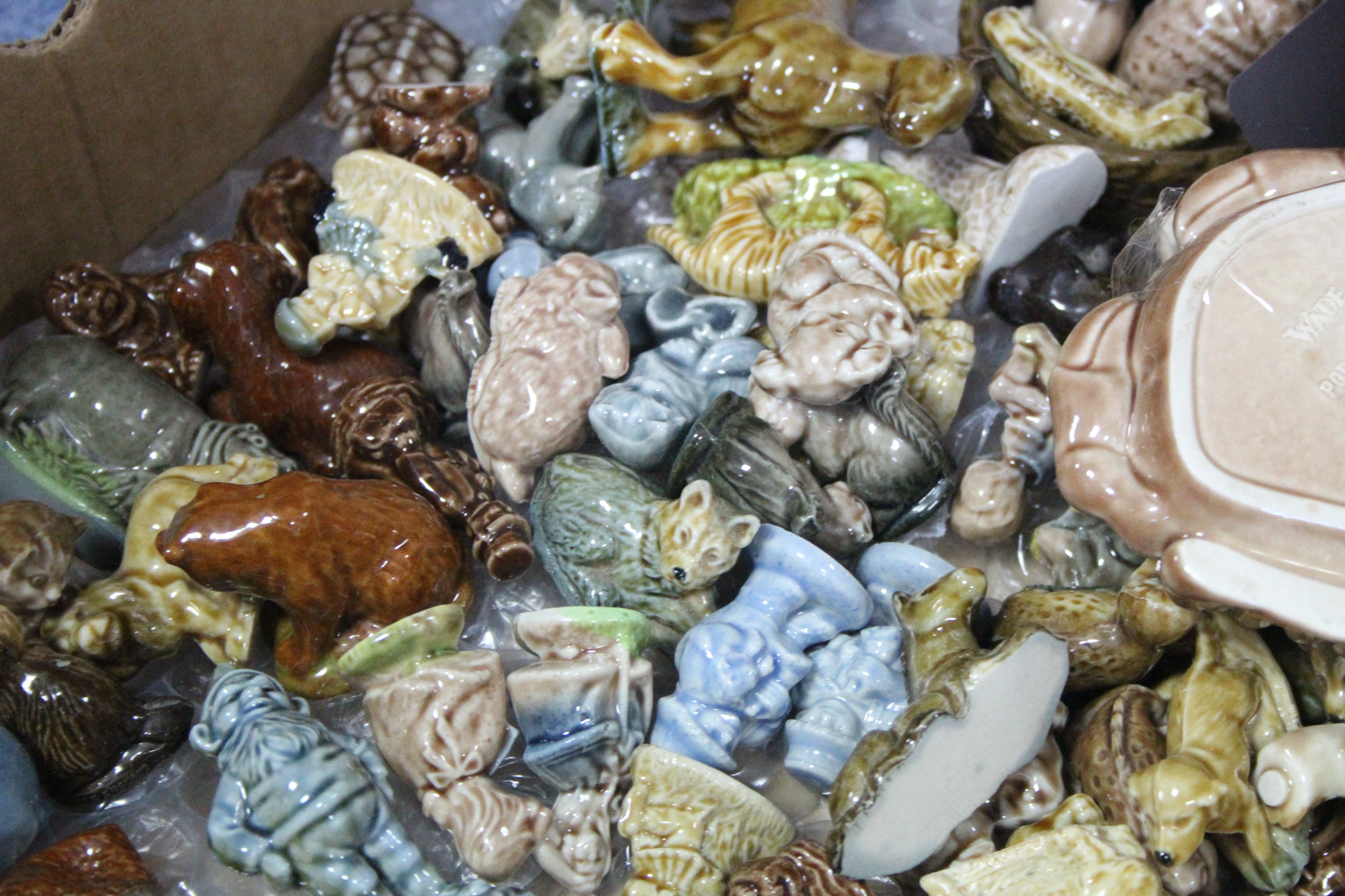 A collection of approximately one hundred various Wade ornaments, boxed & un-boxed.