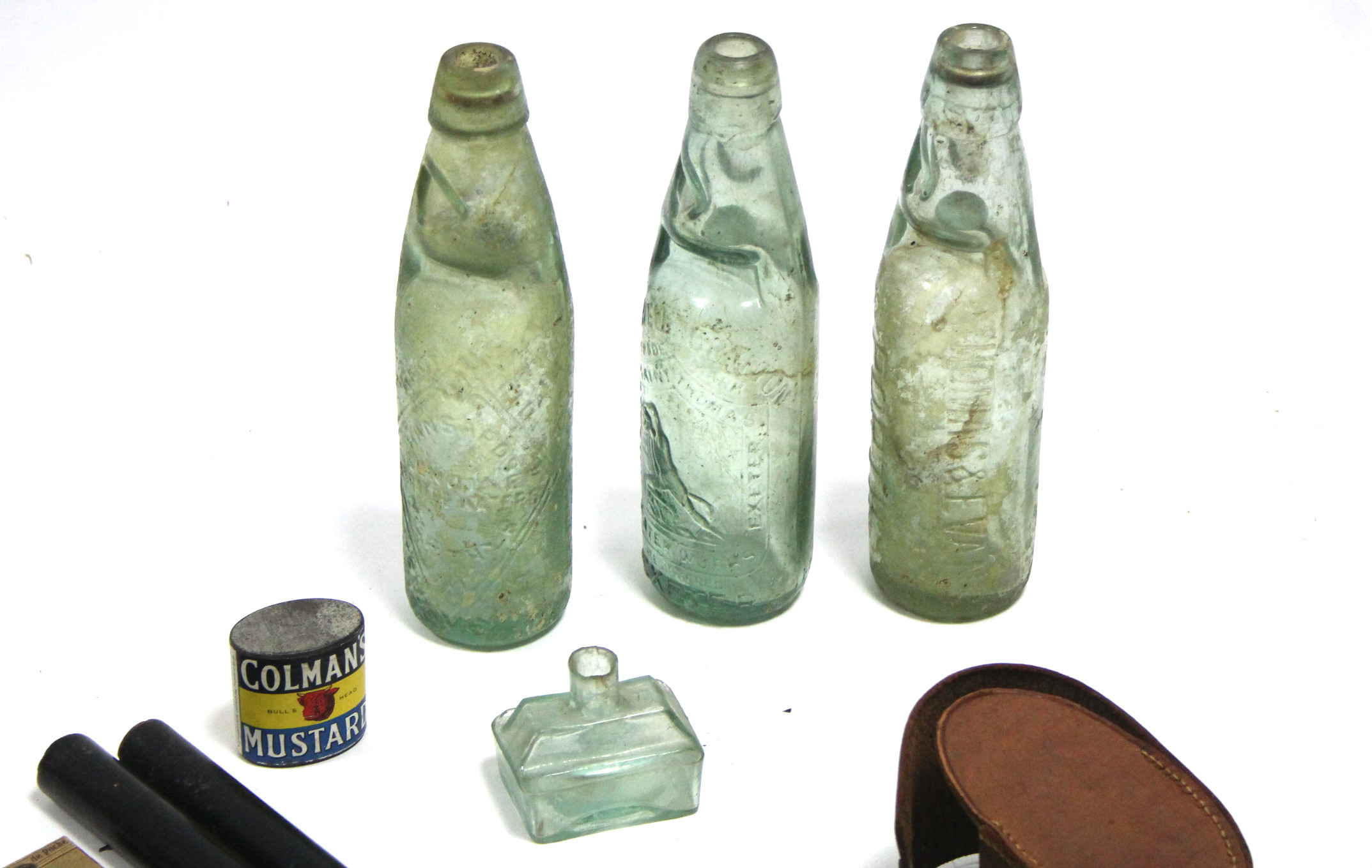 Three green tinted glass bottles “Hansards”, Kerswell & Grafton”, and “Thomas & Evans”; Two ebony - Image 2 of 2