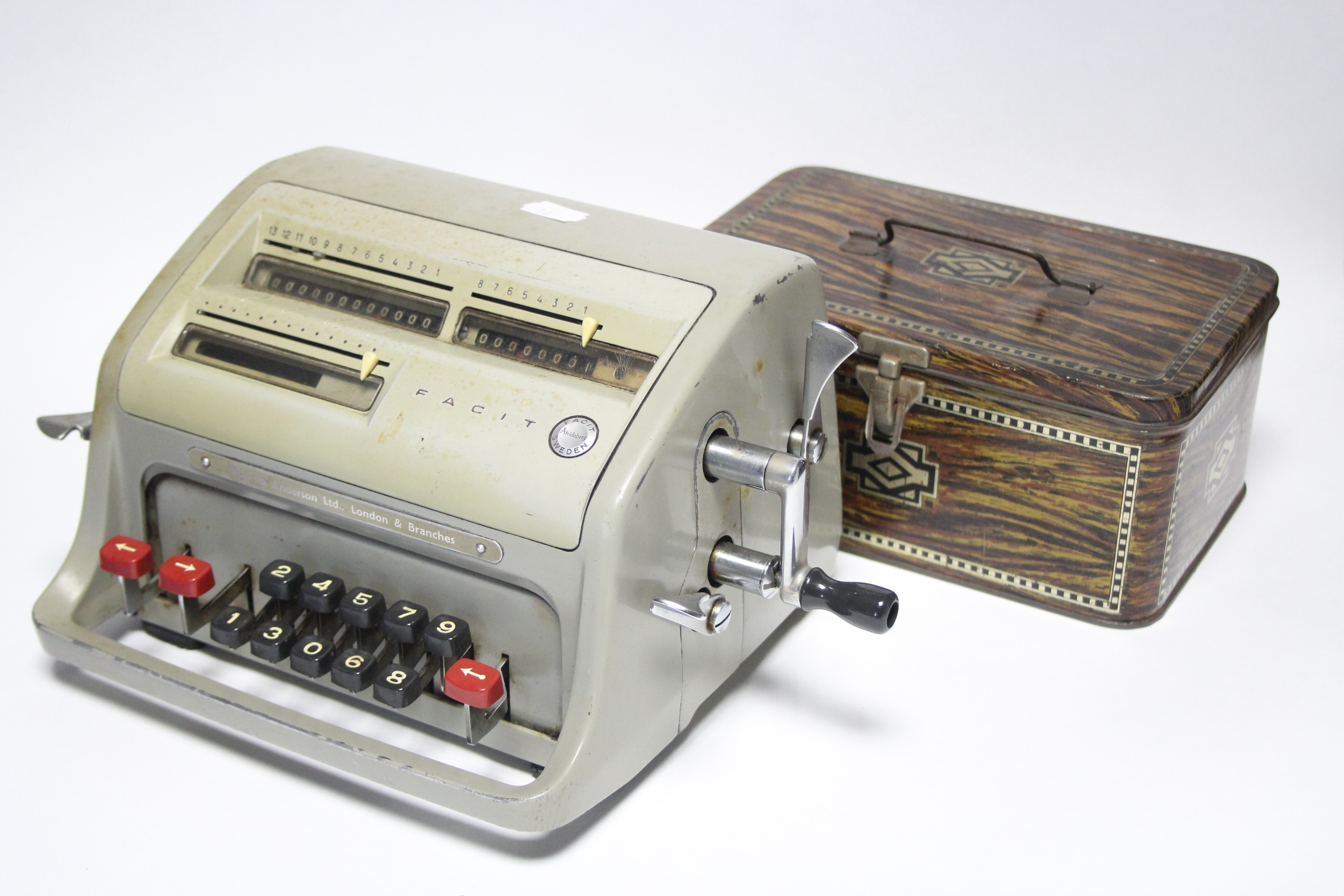 A Facit calculating machine; a cartridge box; an advertising tin, etc