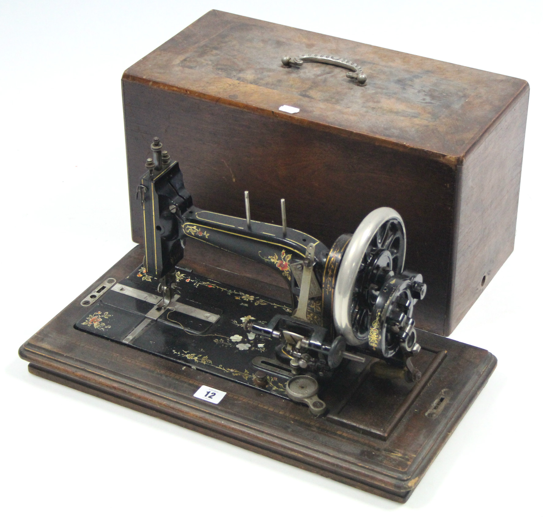 A late 19th/early 20th century hand sewing machine by J. Collier & Sons of London, with walnut