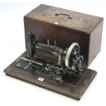 A late 19th/early 20th century hand sewing machine by J. Collier & Sons of London, with walnut